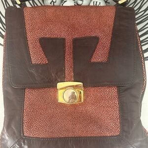 Brown and Red Textured Leather crossbody bag.